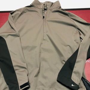 Nike golf series pull over water proof coat.